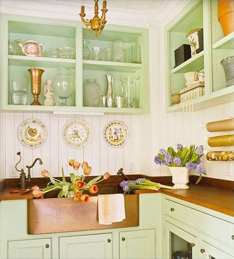 It is vibrant and cool at the same time. cottage kitchen pastel green cabinets copper farmhouse ...