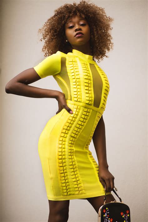 Free Photo Curly Haired Woman In Yellow Bodycon Dress Afro Hairdo