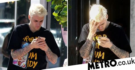 Justin Bieber Looks Stressed And Frowns At Something On His Phone