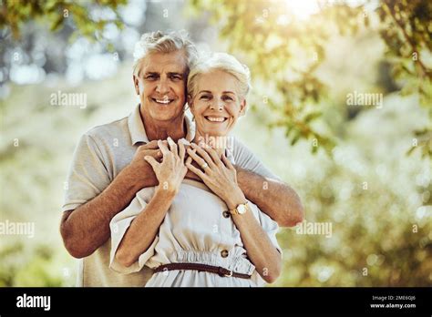 Elderly Couple With Hug In Park And Love With Marriage Portrait
