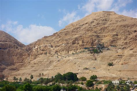 At the foot of the mount palm trees and lush vegetation grow and the yellow and orange hued mountain slopes rise 360 meters above sea level. West Bank - Jericho and Bethlehem | the M chronicles