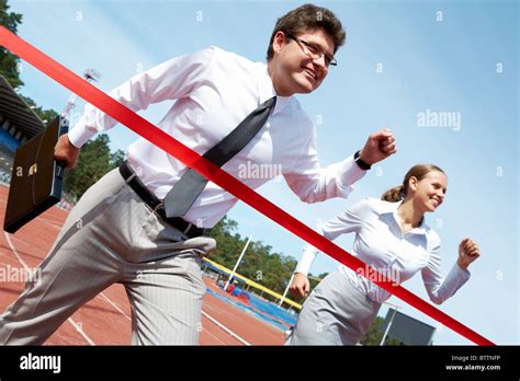 Photo Of Successful Businessman Crossing Finish Line During Race Stock