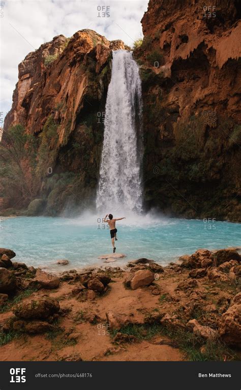 Man Running And Jumping Into Havasu Falls In Arizona Stock Photo Offset