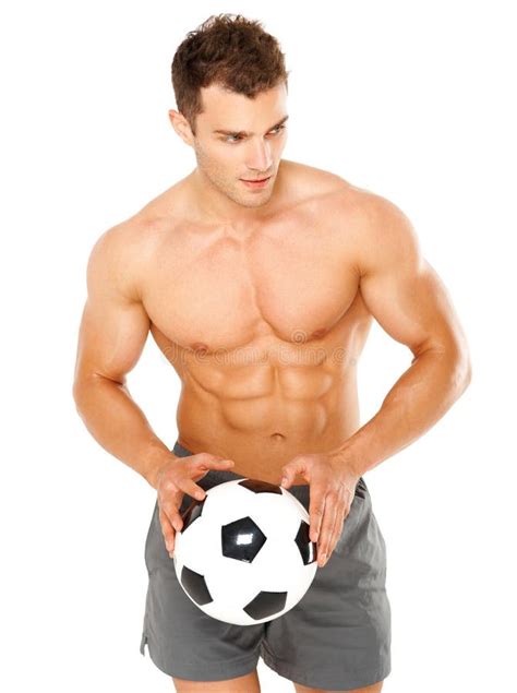 Shirtless Football Soccer Player In Jeans With Ball Standing Stock