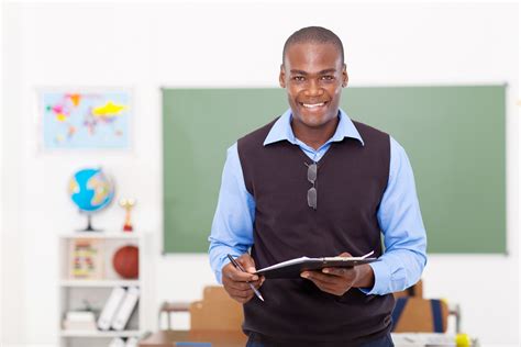 Male Teacher Holding A Clipboard Black Men Teach