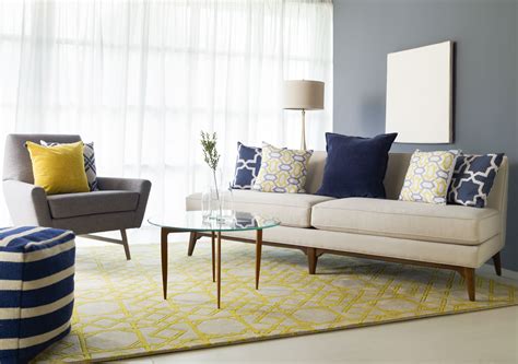Living room furniture online in india. Simple and elegant seating area features patterns that work lovely together from the geometric ...