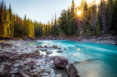 Фото Лучи света Канада Природа Леса Озеро Пейзаж река Камень