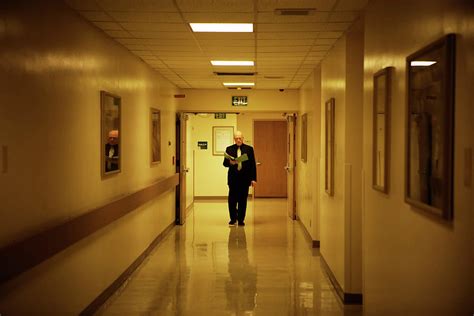 A Man Walking Down A Hallway Photograph By Ron Koeberer Pixels