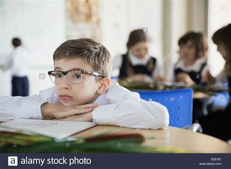Bored School Boy In Classroom Stock Photo Alamy