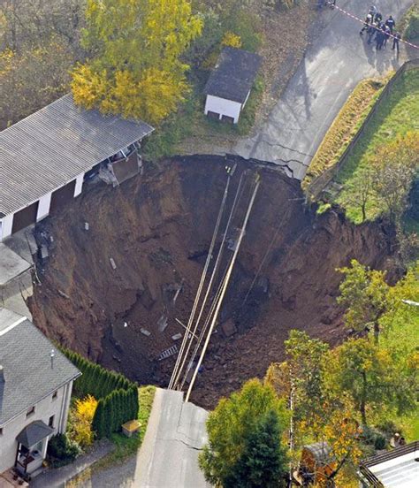 Sinkholes Craters And Collapsed Roads Around The World In Pictures