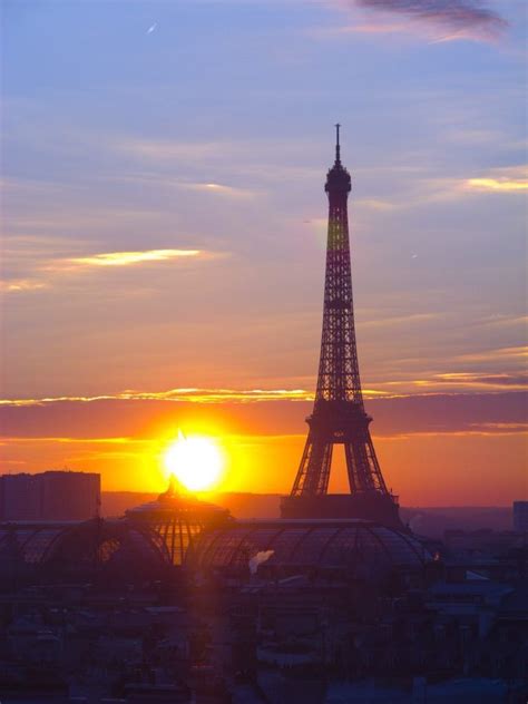 The Eiffel Tower In Paris At Sunset