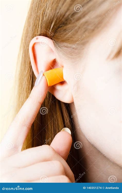Woman Putting Earplugs Stock Photo Image Of Sound Woman 140351274