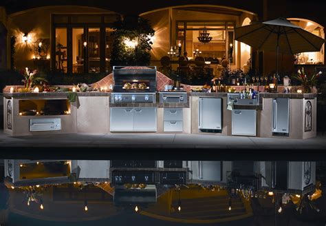 Bbq island was cover with an entertainers oasis, with double height ceilings, integrated kitchen, sink and backlit bar fridges. Barbecue Islands - Las Vegas Outdoor Kitchen