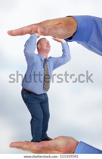 Man Under Pressure Between Two Hands Stock Photo 111319592 Shutterstock