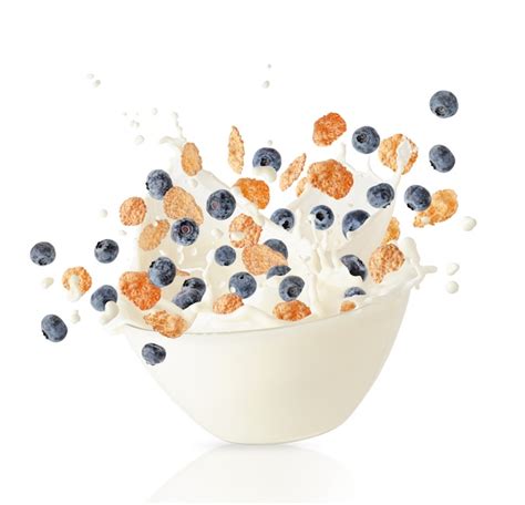 premium photo cereal corn flakes and blueberries falling into bowl with milk splash
