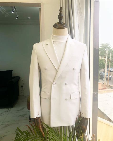 Shop An Ivory White Double Breasted Peak Lapel Suit Deji Kola