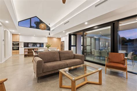 Stunning windows in this living room let in tons of natural light and the use of the round windows are beautiful! A Unique Vaulted Ceiling and Clerestory Windows Bring in ...