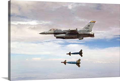 An F 16 Fighting Falcon Releases Two Gbu 24 Laser Guided Bombs Wall Art