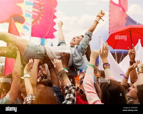 Woman Crowd Surfing At Music Festival Stock Photo Alamy