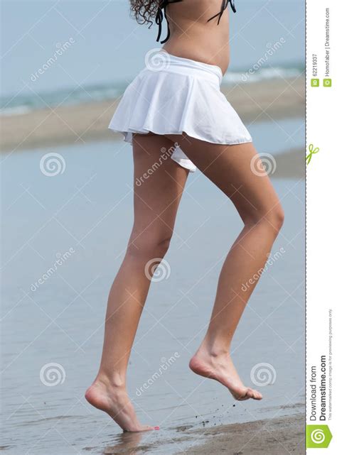 Slim Woman With Beautiful Body Wearing Mini Skirt And Bra