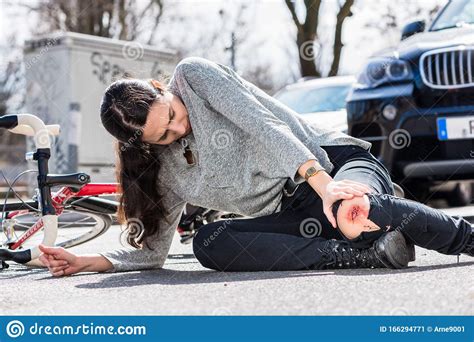 Young Woman Fallen Down After Severe Injury In Bicycle Accident On The