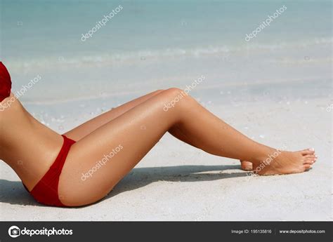 Sexy Suntan Bikini Woman Legs Relaxing Lying White Sand Beach Stock