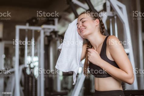 Young Attractive Using Towel To Wipe The Sweat Relaxation After Hard