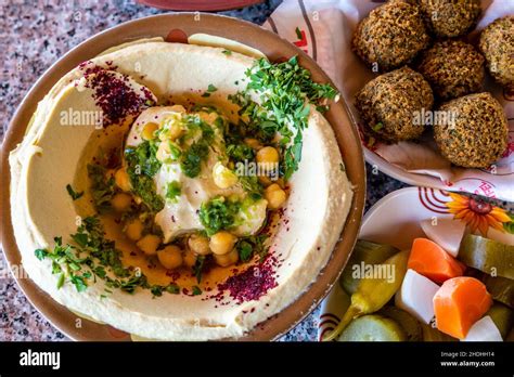 Traditional Jordanianarabic Dishes Of Falafel Hummus And Pickles