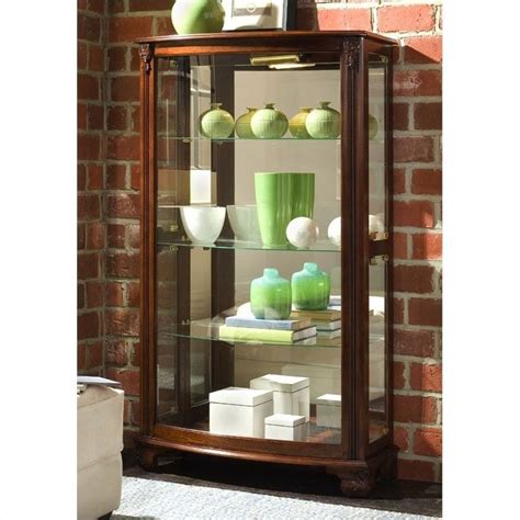 Arched crown molding and canted. Pulaski Gallery Mantel Curio Cabinet - 20878