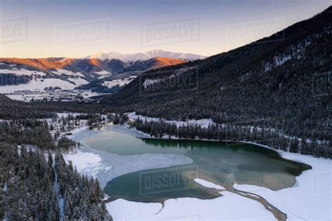 Sunrise Over The Village Of Dobbiaco And Frozen Lake Val Pusteria