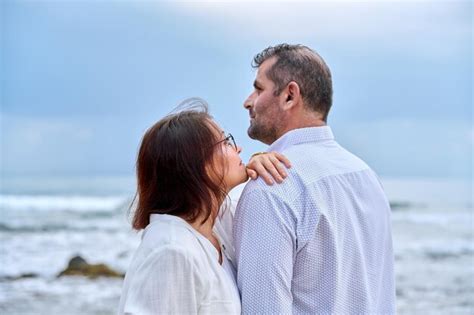 Premium Photo Outdoor Portrait Of Mature Couple Hugging On The Seashore