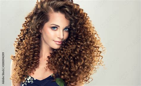 Brunette Girl With Long And Shiny Curly Hair Beautiful Model Woman