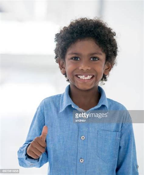 Black Child Thumbs Up Photos And Premium High Res Pictures Getty Images