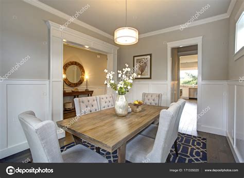 Elegant Transitional Dining Room With Board And Batten Walls Stock