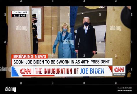 A Cnn Television Screen Shot Of U S President Joe Biden Walking With