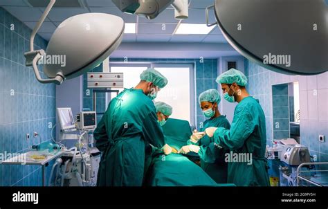 Group Of Surgeon At Work In Operating Room In Hospital Stock Photo Alamy