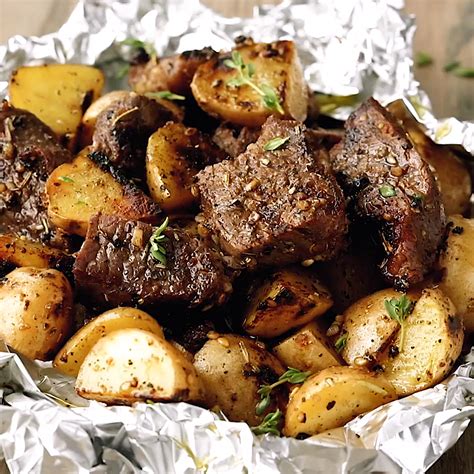 This dish packs just160 calories for 29 grams of protein in each serving. Juicy and savory seasoned Garlic Steak and Potato Foil ...