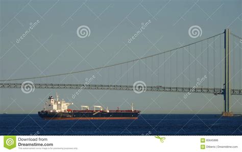 Ocean Cargo Ship And Suspension Bridge Editorial Photo Image Of Water