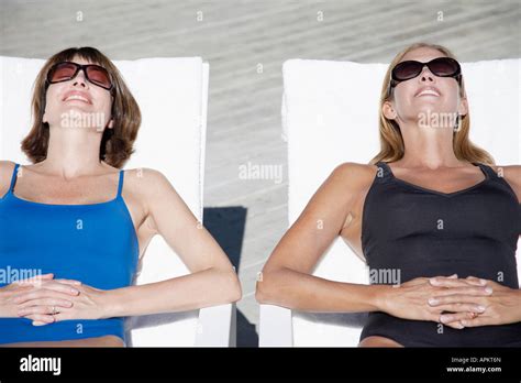 Two Women Sunbathing High Angle View Stock Photo Alamy