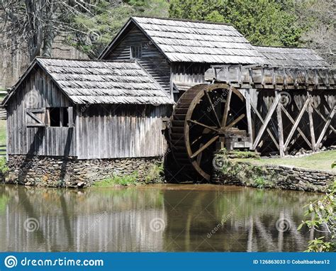 Old Mill With Water Wheel By A Pond Stock Image Image Of Water Like