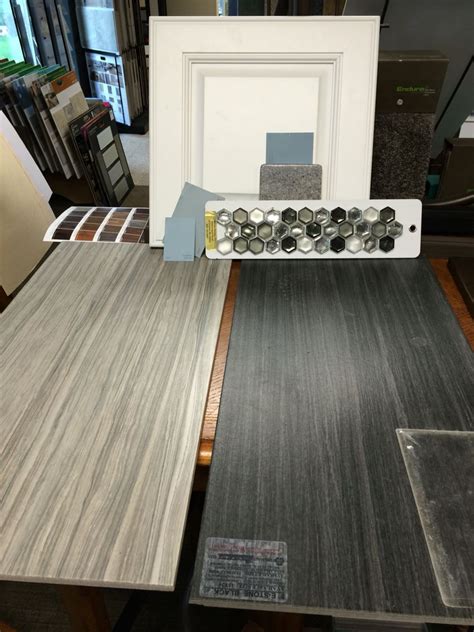 Our stone tiles' natural colors show rich shades and sometimes a bit of sparkle. White vanity, light gray tile floor, combo of light and ...
