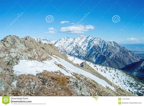 Landscape Of Snow Capped Peaks Of The Rocky Mountains In Sunny Weather