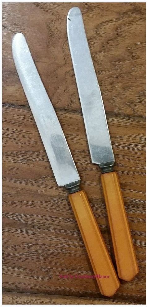 Lot Of 2 Peerless Stainless Steel Butterscotch Carved Handle Knives