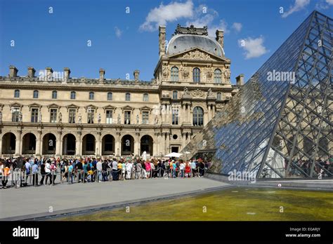 Paris The Louvre Museum Pyramid The Queue At The Entrance Stock
