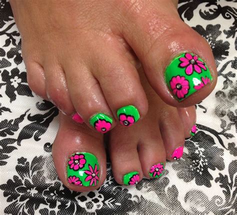 Whether done freehand with a brush or with the help of stamps, a floral effect is surprisingly easy — and always lovely. Summer Pedicure- fun bright green with hot pink flowers ...