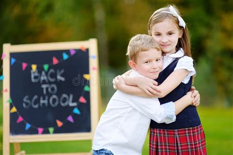 Two Adorable Little Schoolkids Feeling Excited About Going Back To