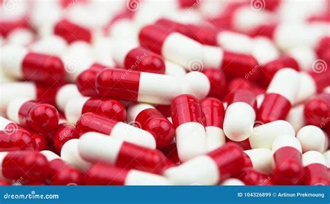 Red And White Antibiotics Capsule Pills Slide And Moving From Left To