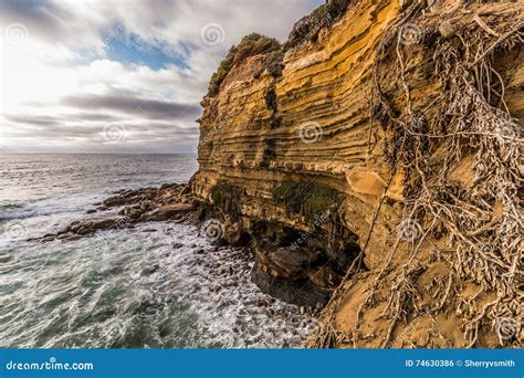Side Of Cliff With Ocean And Cloudy Sky Sunset Cliffs Stock Photo