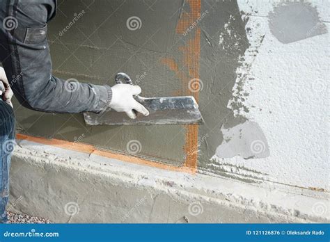 Contractor Plastering Wall With Spatula Fiberglass Mesh Plaster Mesh