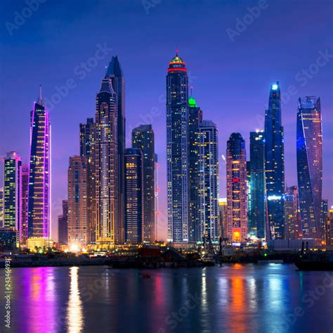 Dubai Marina Skyline At Night With Water Reflections United Arab